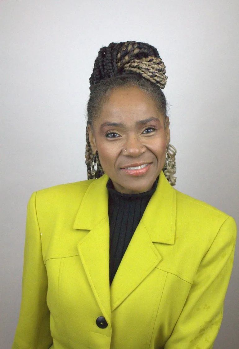 Shannon Wilson Green in a yellow blazer, founder of SIG Pathway housing in Louisville KY